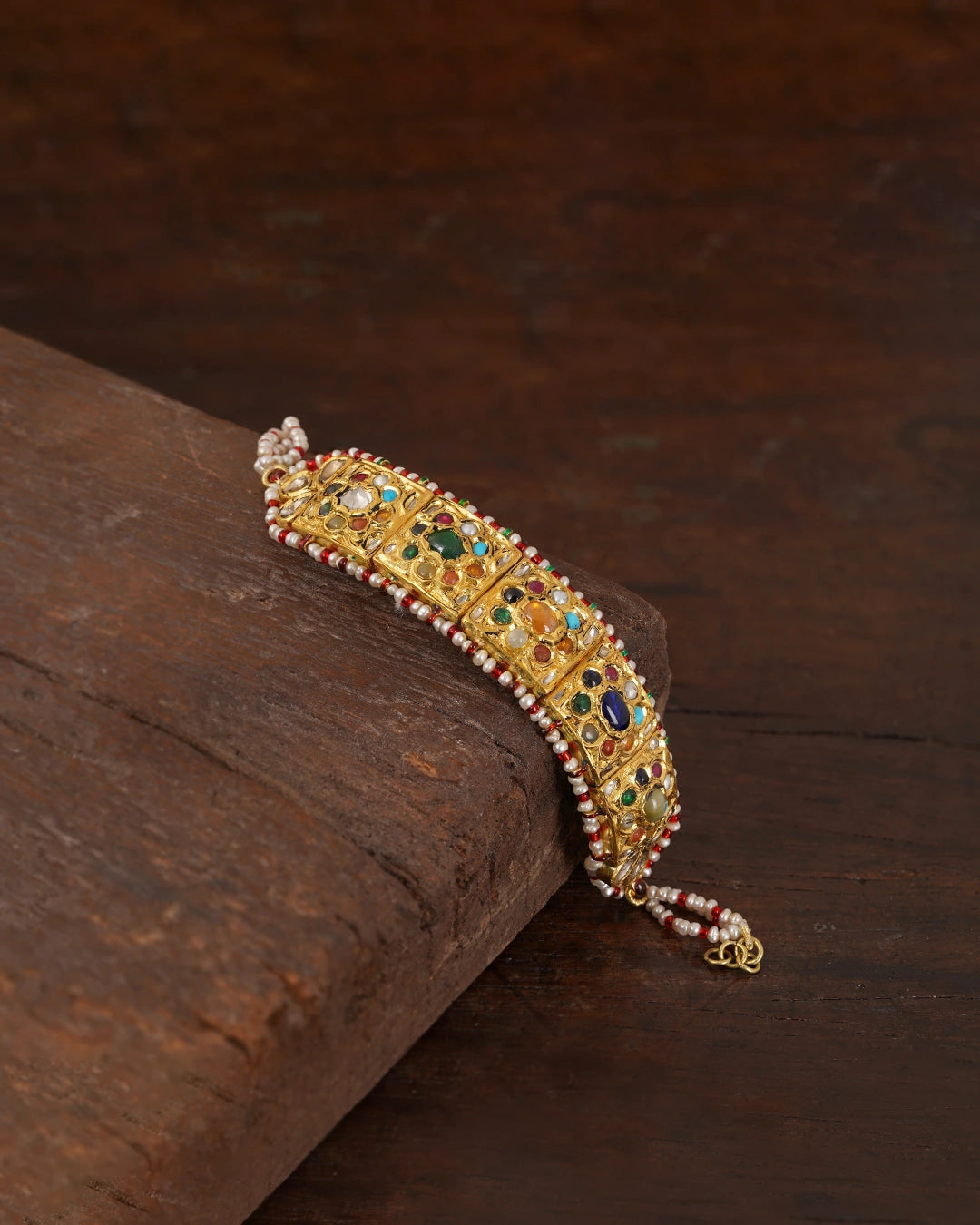 gold polki and navratna bracelet