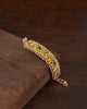 gold polki and navratna bracelet