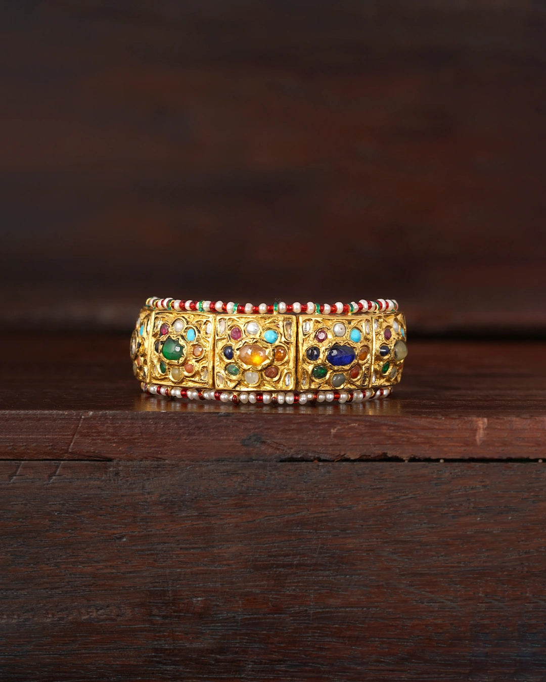 gold polki and navratna bracelet